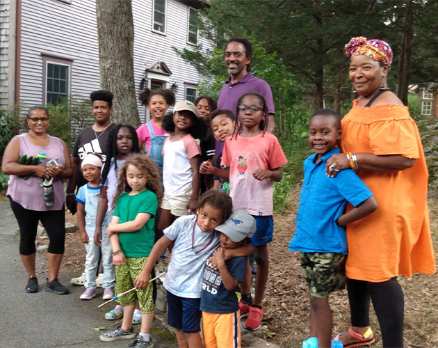 group photo of smiling kids with their teachers and mentors african history for kids